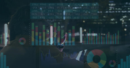 Leaning data analyst wearing over-ear headphones analyzing bar charts on night rooftop, copy space. Technology, analytics, visualization, urban, nocturnal, professional, innovationの写真素材