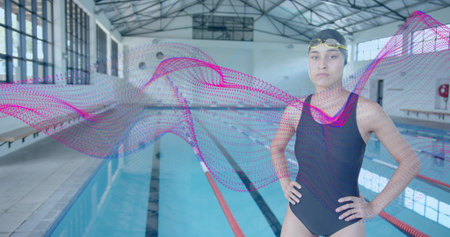 Adjusting goggles swimmer wearing racing suit on pool deck, with digital wave graphic, copy space. Athletic, aquatic, performance, minimalist, modern, fitness, leisureの写真素材