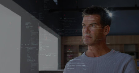 Displaying software developer gazing through office window with cabinets, overlaying code patterns. Technological, innovation, focus, concentration, ambiance, creative, modernの写真素材