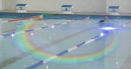 Gliding swimmer performing freestyle stroke in pool lane, with lane ropes, copy space. Athlete,...