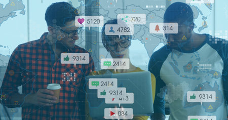 Collaborating three professionals reviewing social metrics in office, with laptop and icon overlays. Team, innovation, analytics, modernism, technology, communication, workspaceの写真素材