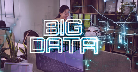 Inspecting VR headset and reviewing data charts, Chinese IT professional working at office desk. Technology, innovation, digital, workspace, professional, futuristic, data visualizationの写真素材