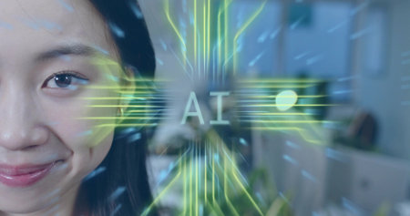 Smiling Chinese woman displaying neon-green AI overlay in office with desks and screens, copy space. Technology, innovation, futurism, digital, workspace, communication, professionalの写真素材