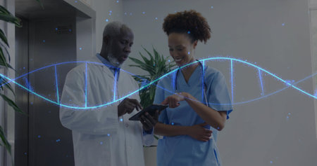 Doctor in labcoat and nurse in scrubs viewing tablet in clinic hallway, with DNA helix, stethoscope....