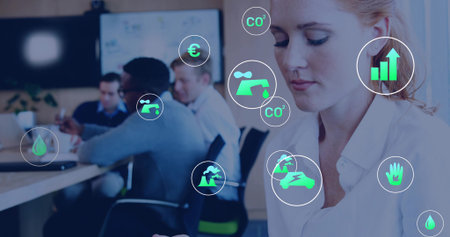 Woman wearing white shirt analyzing tablet data in boardroom, with green data icons, copy space. Corporate, teamwork, sustainability, analytics, professional, modern, collaborationの写真素材