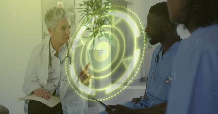 Medical team discussing floating holographic interface in hospital corridor lounge, with tablet....