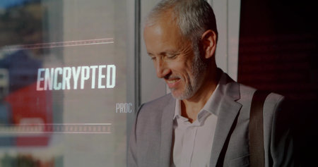 Standing businessman wearing gray suit with shoulder bag in lobby, with ENCRYPTED glass, copy space....