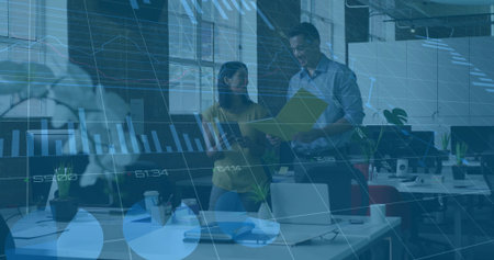 Coworkers reviewing yellow folder and checking smartphone in open plan office, with laptop. Collaboration, teamwork, modern, productivity, business, workspace, analysisの写真素材