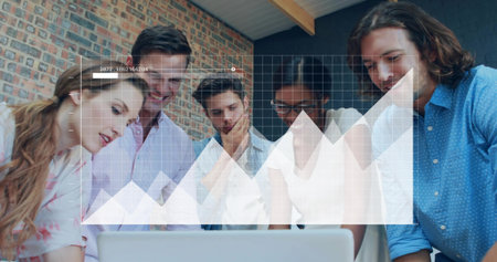 Analyzing team members reviewing data around silver laptop in coworking office, with graph overlay. Collaboration, innovation, modern, startup, productivity, brainstorming, technologyの写真素材