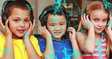 Listening three children wearing black over-ear headphones in classroom, with digital network grid. Technology, connection, education, innovation, collaboration, entertainment, vibrantの写真素材