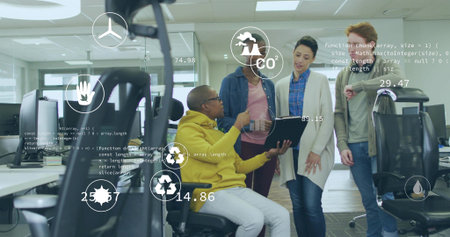 Collaborating four colleagues interacting with AR overlays at office, with wheelchair and laptop....