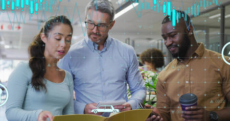 Reviewing three professionals studying yellow folder and notebook in bright office, with coffee cup. Collaboration, teamwork, corporate, modern, workspace, productivity, communicationの写真素材