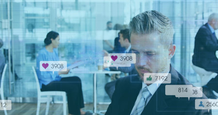 Observing executive in suit and tie reviewing laptop with reaction icons at lounge, copy space....