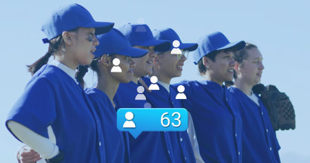 Linking baseball teammates wearing blue jerseys on baseball field, holding glove, showing eye black....