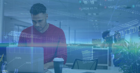 Leaning man in red sweater reviewing data on laptop in office, with coffee cup, copy space....