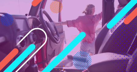 Leaning woman wearing pink hoodie gazing out from red SUV door on sandy beach, copy space....