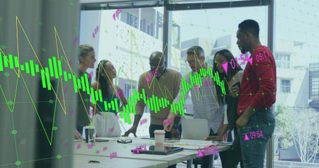 Collaborating colleagues analyzing financial data in meeting room, with laptop and tablet. Business,...