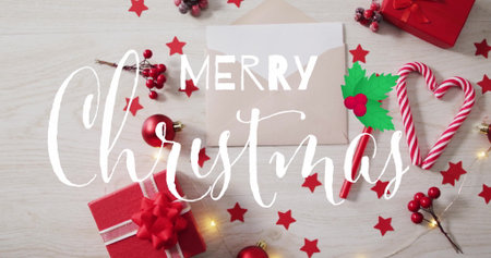 Merry Christmas text image over festive decorations with red stars and ornaments. holiday, celebration, winter, seasonal, greetingの写真素材