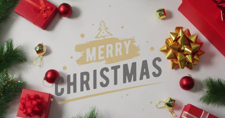 Merry Christmas text image over festive decorations with gifts and ornaments. holiday, celebration, joy, winter, greeting, seasonの写真素材