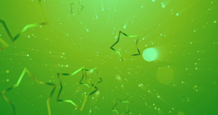 Image of stars and spots falling on green background. Christmas and celebration concept digitally generated image.の写真素材
