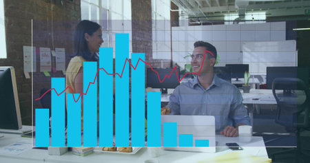 Collaborating colleagues analyzing bar charts and red line graph in office with laptop, coffee mugs....