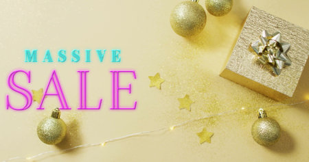 Image of massive sale text over christmas decorations. Shopping and digital interface concept digitally generated image.の写真素材