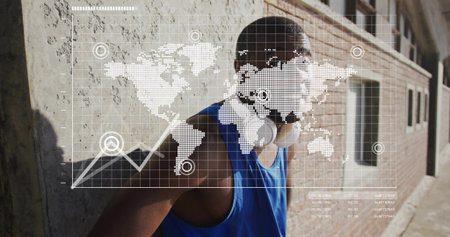 Leaning man in blue tank top shading eyes in alley, featuring white headphones, world map overlay....