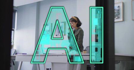 Standing Asian woman wearing cardigan reviewing papers at desk in office with notebook, coffee cup. Professional, workspace, minimalist, productivity, corporate, modern, interiorの写真素材