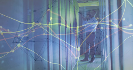 Inspecting admin adjusting server connections in data center corridor, with LED lights, copy space. Technology, cybersecurity, network, infrastructure, digital, professional, modernの写真素材