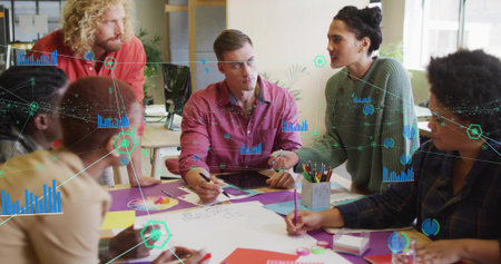 Collaborating team reviewing charts and drawing diagrams with markers in modern office with tablet. Teamwork, brainstorming, data analysis, business strategy, corporate, professional, modernの写真素材