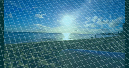 Overlaying transparent digital wireframe grid on sandy beach at sunset, with footprints and towel. Futuristic, serenity, landscape, technology, relaxation, coastal, minimalistの写真素材