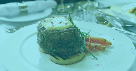 Showcasing seared steak on bread round on plate at dining table, with baby carrots and salicornia. Gourmet, fine dining, culinary, presentation, elegance, sophistication, luxuryの写真素材