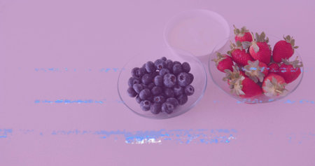 Presenting three glass bowls on kitchen countertop, with blueberries, strawberries, and yogurt. Minimalist, fresh, vibrant, healthy, bright, clean, organicの写真素材