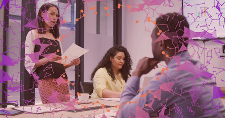 Presenting Asian businesswoman leading meeting with documents in meeting room, with network overlay....