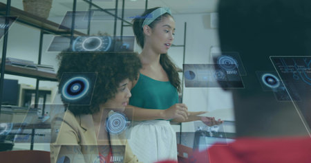 Presenting woman in green top holding file, projecting holographic UI at office, copy space. Technology, collaboration, innovation, modernity, communication, digital, professionalの写真素材
