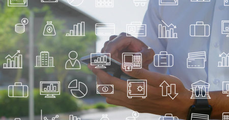Displaying man wearing white shirt holding smartphone in city, with smartwatch and financial icons. Business, finance, technology, investment, professional, urban, innovationの写真素材