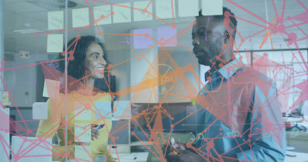 Collaborating coworkers brainstorming behind glass wall at office with network overlay. Innovation, teamwork, creative, modern, professional, communication, strategyの写真素材