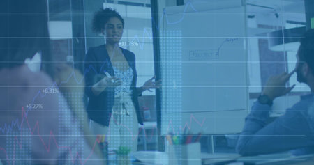 Presenting African American woman standing beside flip chart at office, with digital graph overlay....