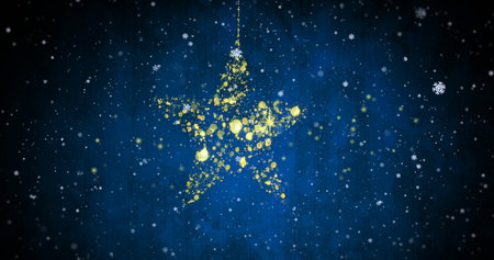 Golden star made of particles with falling snowflakes image on blue background. Holiday, winter, Christmas, festive, decoration, glitterの写真素材