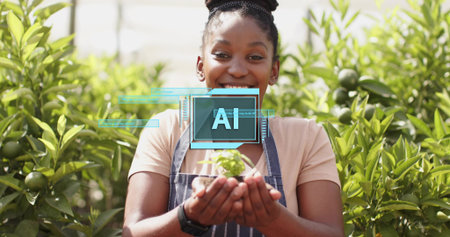 Smiling woman holding seedling, wearing striped apron in citrus grove. Gardening, sustainability, nature, growth, eco-friendly, outdoor, agriculturalの写真素材