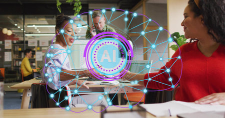 Collaborating team in casual clothes pointing at monitor in office, with laptop and documents. Collaboration, teamwork, innovation, technology, modern, professional, brainstormingの写真素材