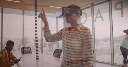 Interacting woman in striped shirt wearing VR headset reaching at conference table, with phone....