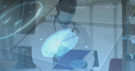 Writing doctor wearing mask and gloves on clipboard in consultation room, with holographic graphics. Healthcare, telemedicine, innovation, professionalism, technology, diagnostics, medicalの写真素材