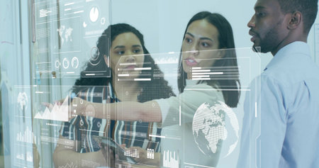 Pointing professionals wearing business attire analyzing glass partition at office, with smartphone. Collaboration, teamwork, data visualization, analytics, professional, modern, corporateの写真素材