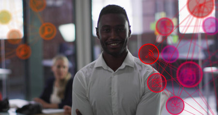 Smiling man wearing white shirt folding arms in office, with glass partitions and network overlay....