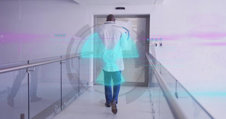 Walking doctor wearing white coat and stethoscope down hospital corridor, with digital overlays....