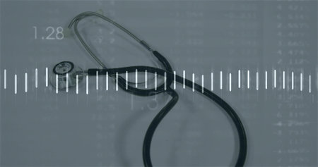 Resting black stethoscope lying on bluish surface, showing white waveform and data grid. Medical, healthcare, digital, analytics, technology, diagnostics, precisionの写真素材