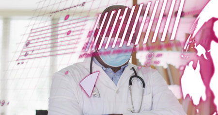 Analyzing data doctor wearing mask viewing pink charts on display in clinic, with stethoscope. Medical, healthcare, technology, professional, clinical, diagnostics, innovationの写真素材