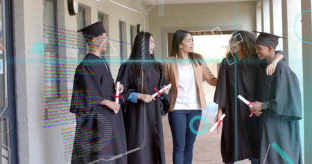 Celebrating mentor and graduates wearing black gowns on campus walkway, holding red ribbon diplomas....
