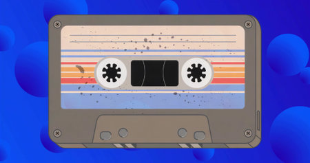 Displaying vintage cassette tape with striped label on bright blue backdrop, with floating bubbles. Nostalgia, retro, abstract, minimalism, design, music, digitalの写真素材